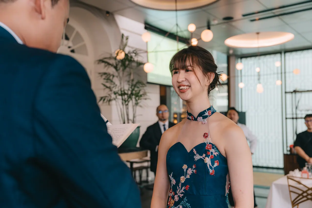 The bride smiles across at the groom during the vows.