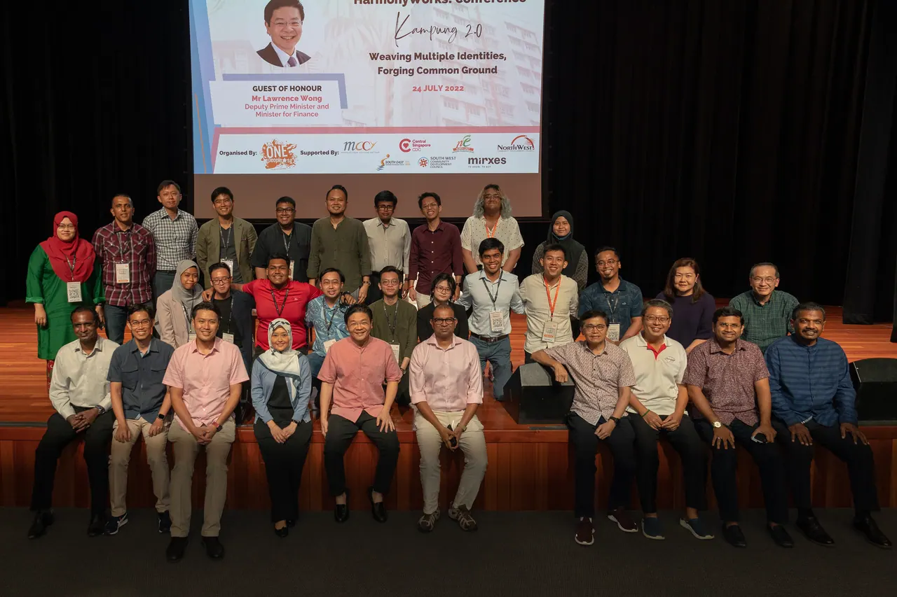 A group photograph on stage.