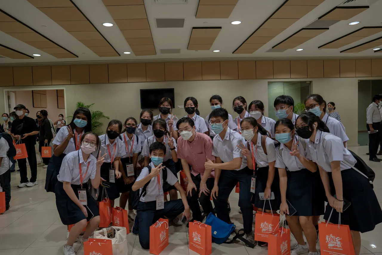 Students pose with the guest of honour.