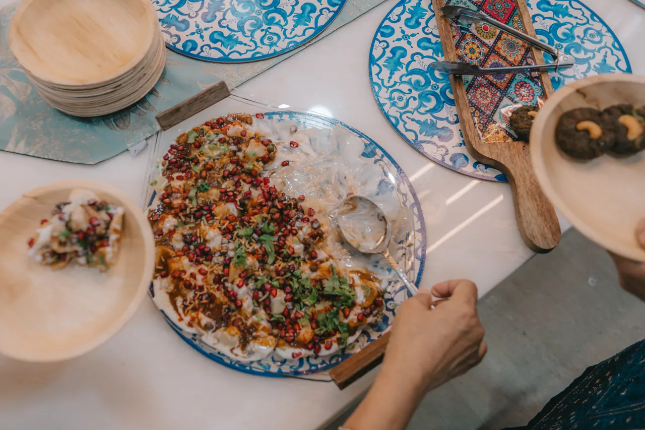A spread of food on patterned plates.