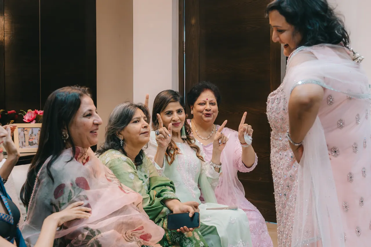 Guests dance in the living room.