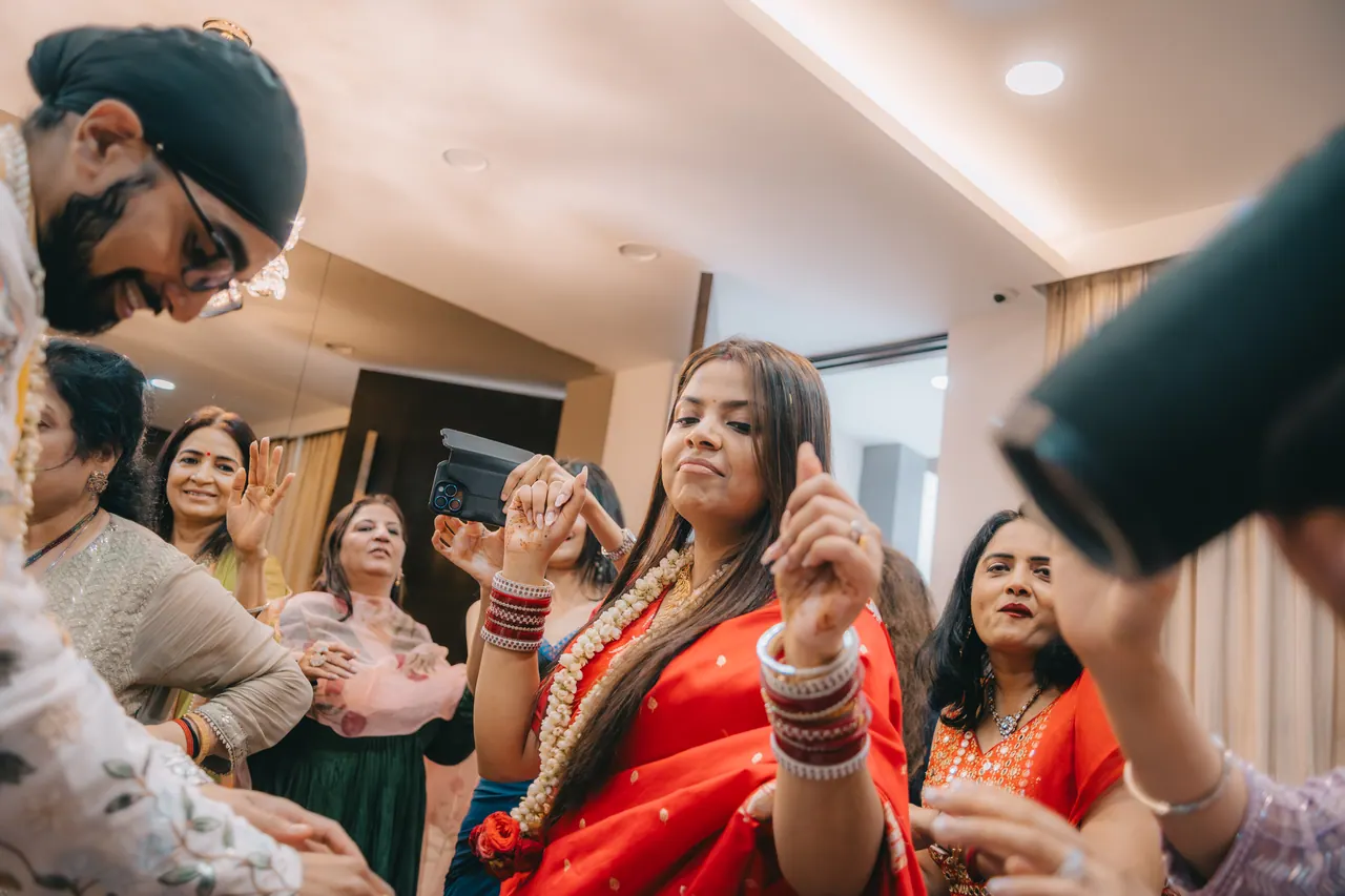 The bride dances, laughing.