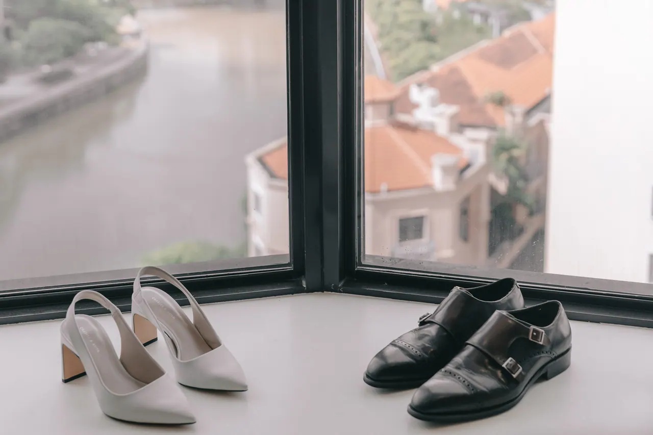 The couple’s shoes on a window ledge above the river.
